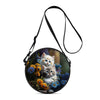 A round black crossbody bag featuring a cartoon cat design with blue and white fur.
