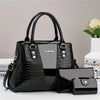 Bolso y clutch de cuero exótico de cocodrilo negro con herrajes dorados