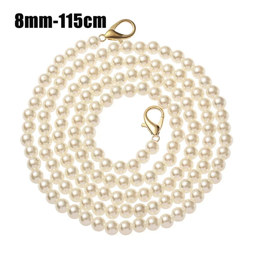A strand of 8mm pearls used as a strap for a handbag or purse.