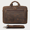 A brown genuine leather briefcase with a handle and flap, shown next to a folded leather strap.