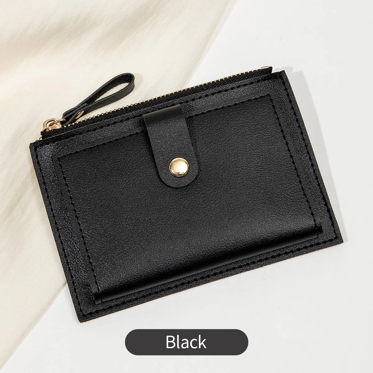Black ultra-thin PU leather card holder wallet with a flap closure shown on a white background.