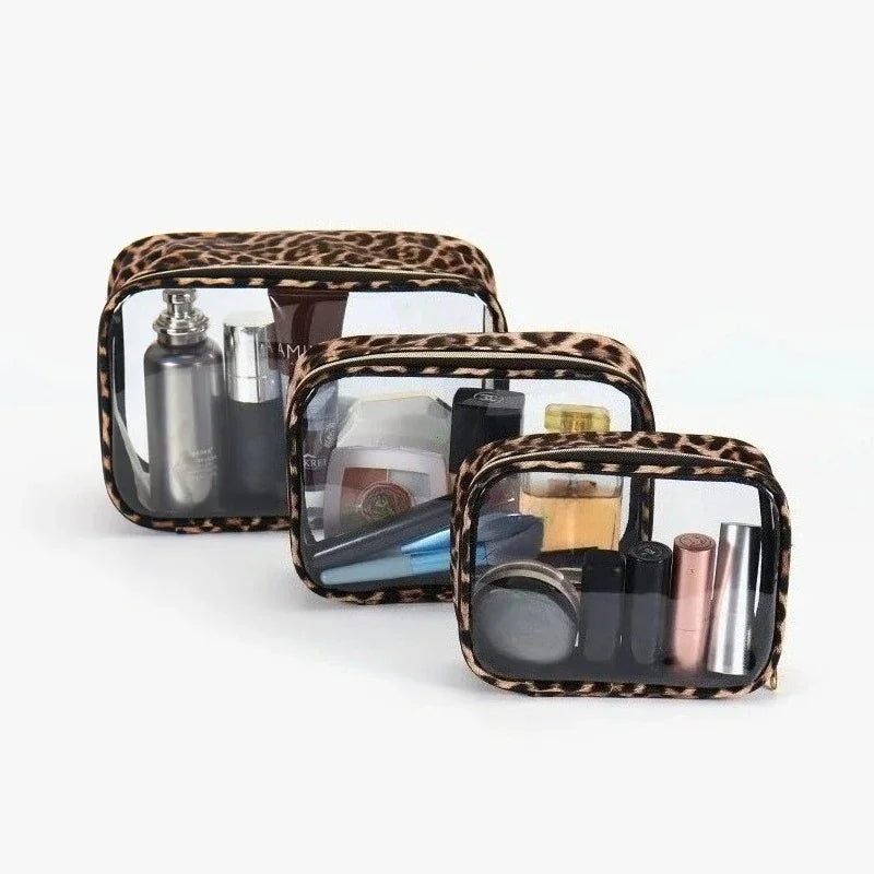 A clear cosmetic organizer bag with a leopard print exterior holding various makeup and skincare products.