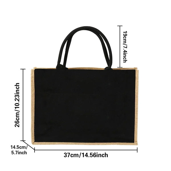 Black vintage jute burlap tote bag with black handles and natural tan edges.