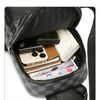A black multifunctional backpack showing various compartments for electronics and accessories.