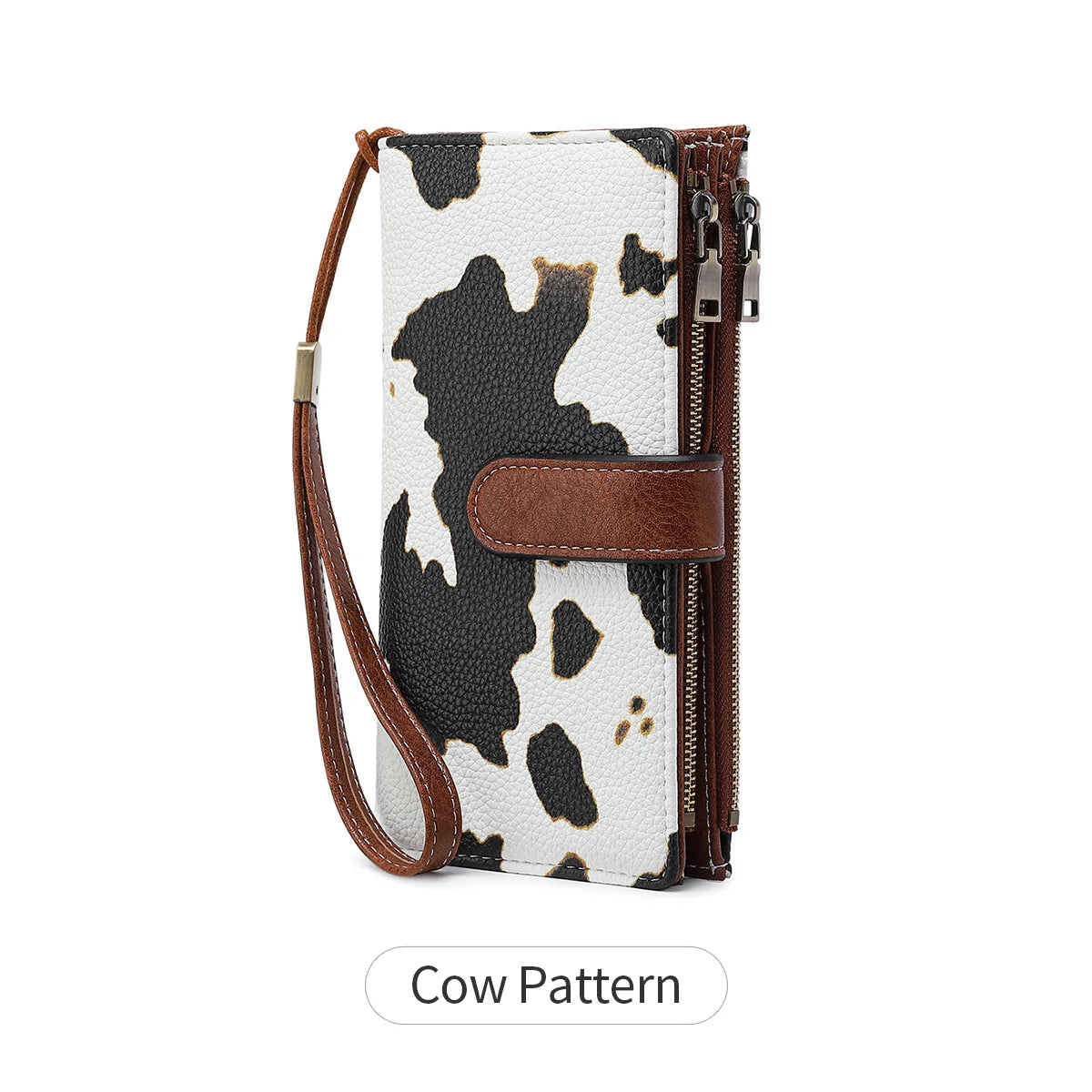 A brown leather trifold clutch wallet featuring a black and white cow pattern.