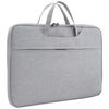 A gray premium laptop sleeve designed for Apple and PC devices.