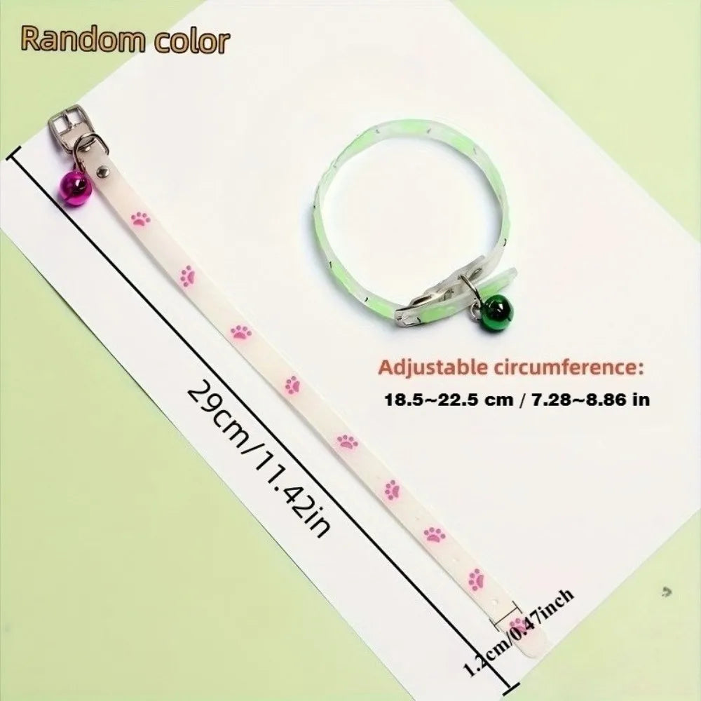 A light green glow-in-the-dark pet collar for dogs and cats with an adjustable strap and a purple bead.