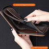 A hand opens a brown leather card clip wallet showing an internal zippered pocket and a bill compartment.