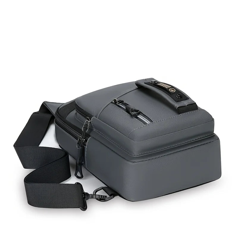 A dark gray men's multi-compartment nylon crossbody sling bag with a black strap.