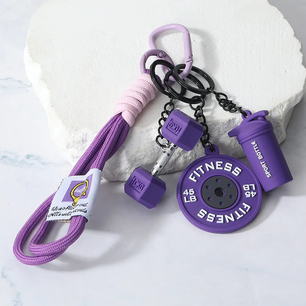 Purple fitness dumbbell keychain charm with pink cord and purple bottle cap