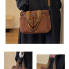 A dark brown corduroy tote bag with adjustable leather straps is shown against a black garment.