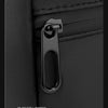 Close-up of a black smooth zipper on a travel backpack.