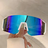 A hand holds a pair of bright blue mirrored sunglasses with white frames against a light background.