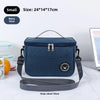 Navy blue insulated portable lunch bag with a gray shoulder strap shown on a white surface.