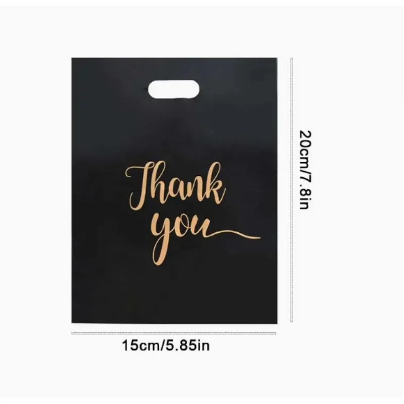 Black gift bag with gold script text that reads Thank you