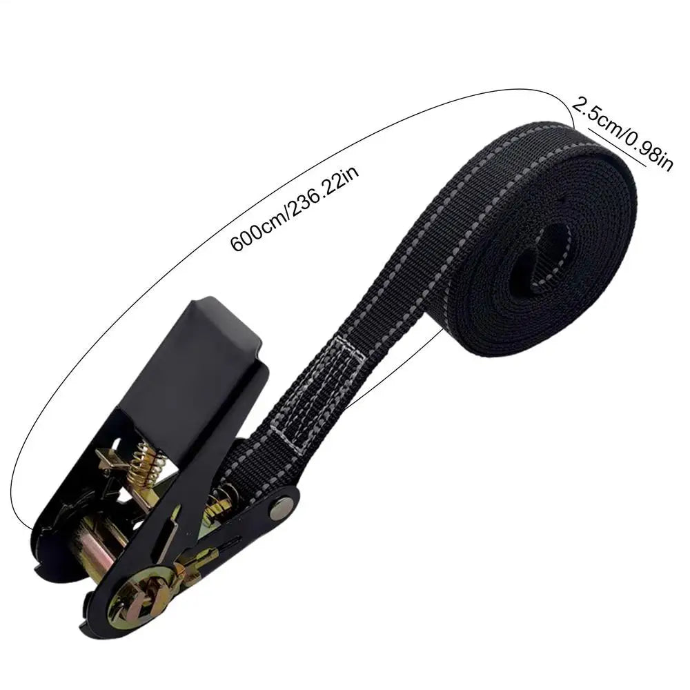 Black heavy duty ratchet tie-down straps coiled on a black strap with a measuring tape.