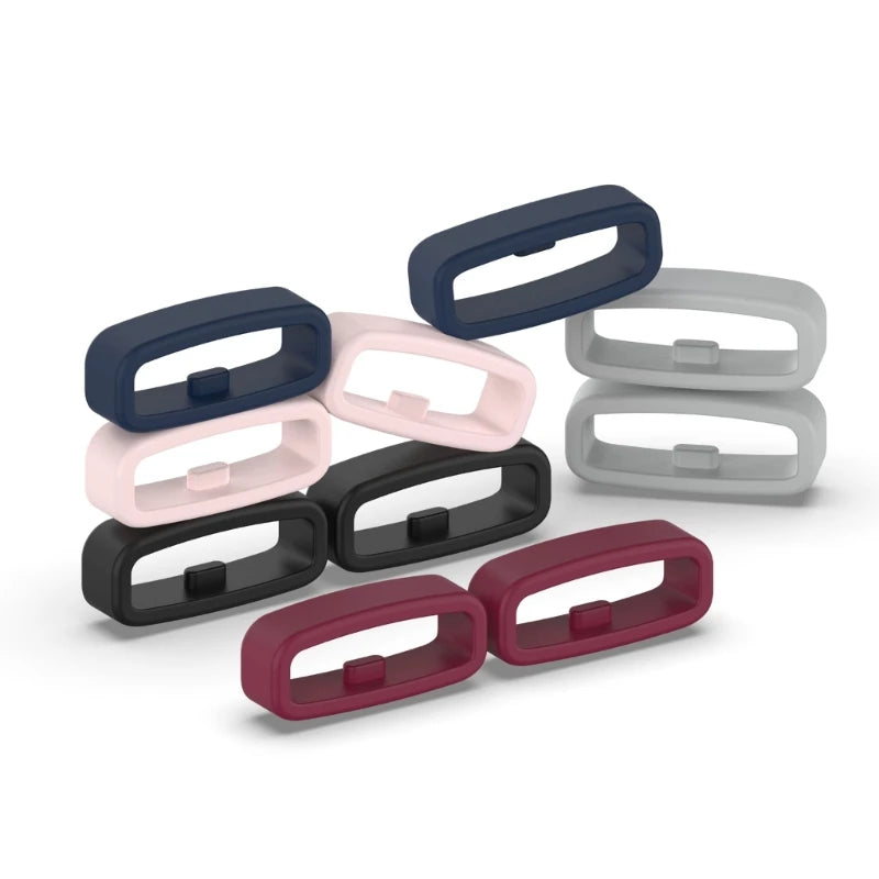 A set of silicone watch strap retainer rings in various shades of blue, pink, and gray.