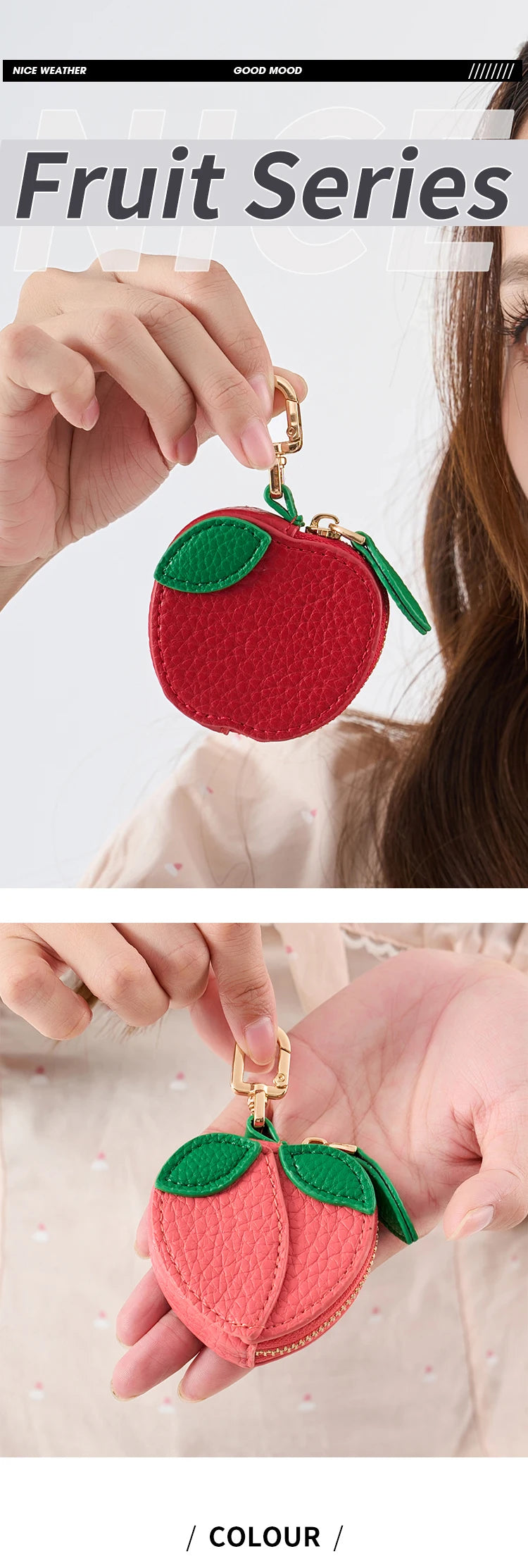 A close-up of a red fruit series coin purse keychain with green leaves, being held by a person.
