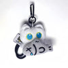 A white cat plush keychain with blue eyes and black accents, attached to a black ring.