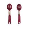 A pair of maroon precision digital kitchen scales with measuring spoons and a digital display.
