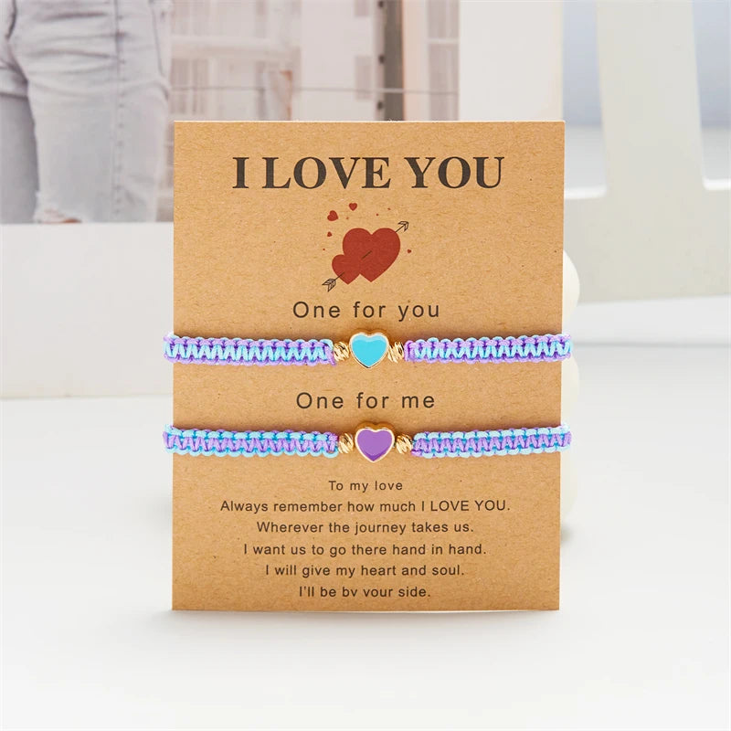 A set of three beaded friendship bracelets with 'I love you' messages presented in a card.