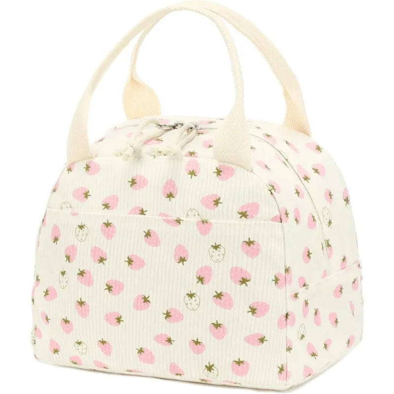 A pale pink and white corduroy lunch bag with a rounded top and fabric handles.