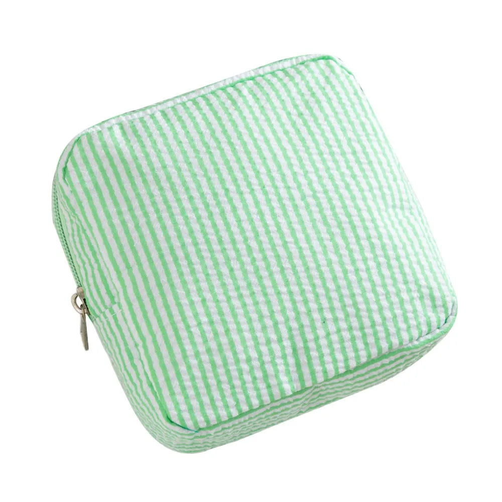 A light green striped storage pouch with a zipper on a white background.