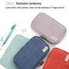Three colored corduroy pencil cases in mint green, navy blue, and burnt orange displayed on a white background.