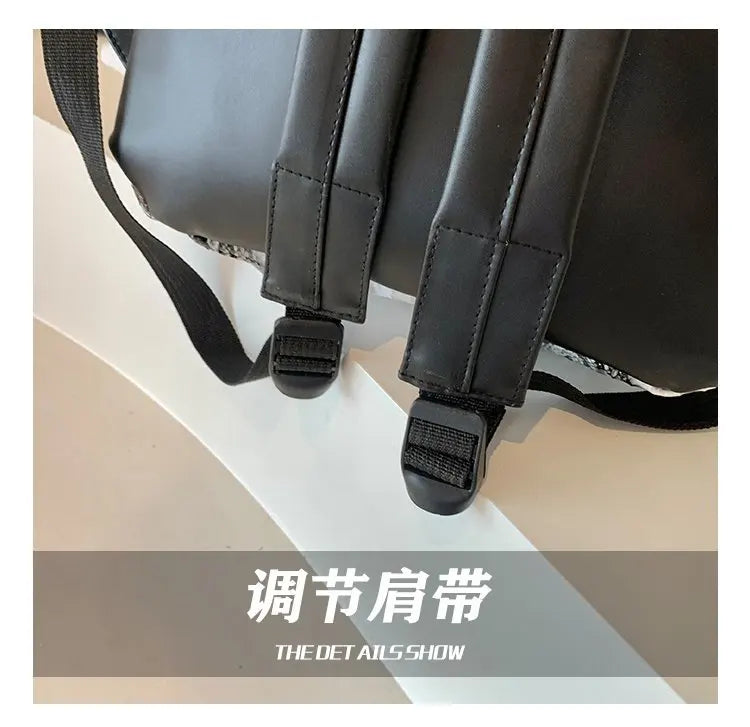 Close-up view of a black hedgehog shaped PU backpack with black straps.