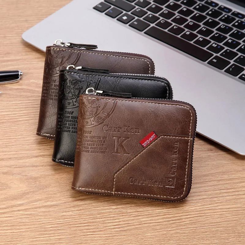 A stack of brown and black men's PU waxed oil leather bifold wallets resting on a wooden surface next to a laptop.
