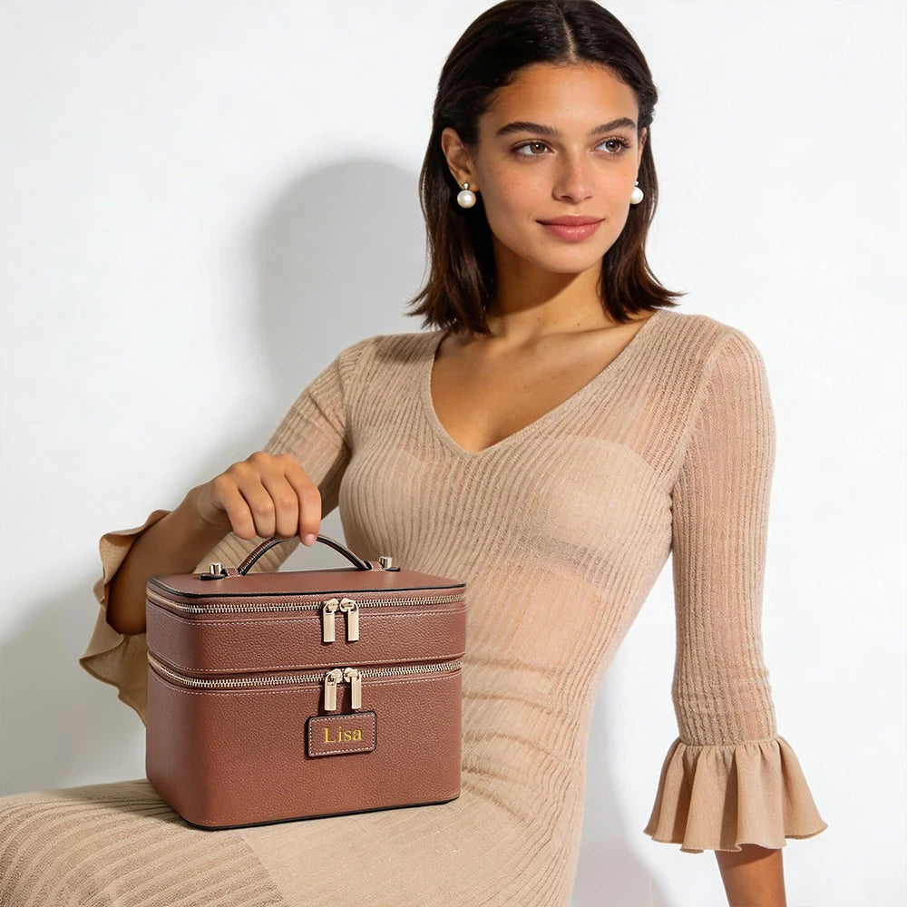 A woman models a brown double-layer makeup storage case with a personalized name on the front.
