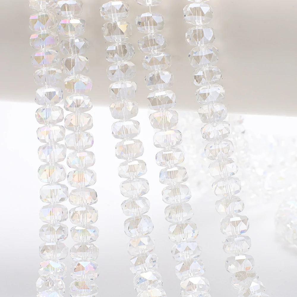Clear AB faceted crystal glass beads in a wheel shape strung together for jewelry making
