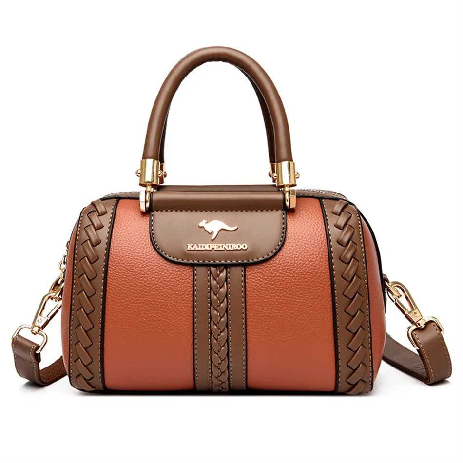 A brown leather shoulder crossbody bag with gold hardware and a woven texture.