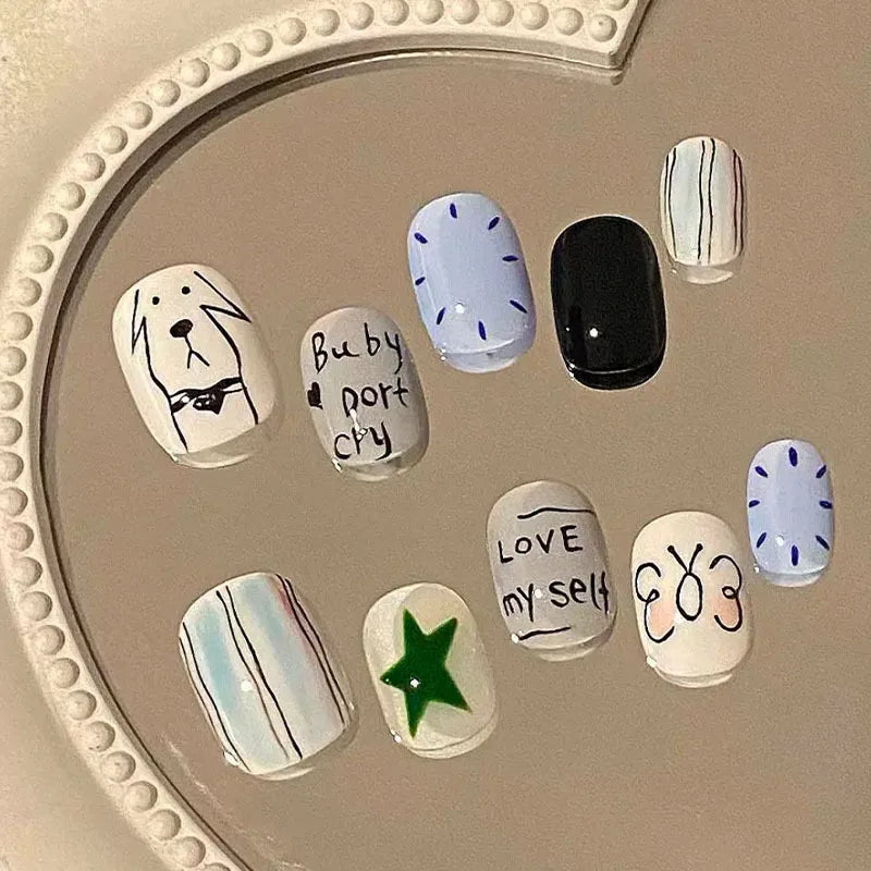A collection of cute cartoon press-on nails featuring various designs and colors on a clear surface.