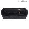 Black felt bag insert organizer with a zipper and a small metal charm