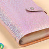 Carnet rose pailleté avec couverture en cuir et une page visible à l'intérieur