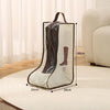 A beige portable waterproof boot storage bag with a brown handle and visible boots displayed on a light rug.