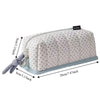 A light gray pencil case with a dot pattern, featuring a light blue trim and a gray fabric strap.