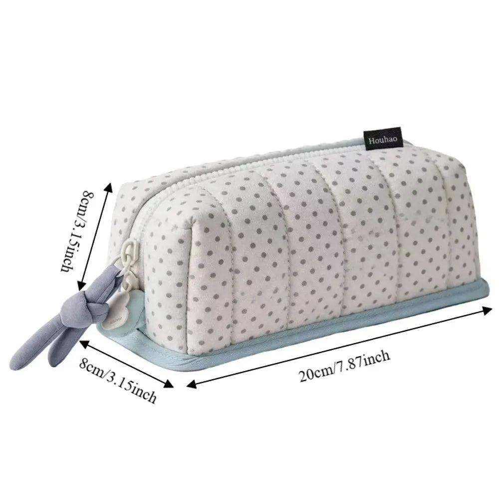 A light gray pencil case with a dot pattern, featuring a light blue trim and a gray fabric strap.