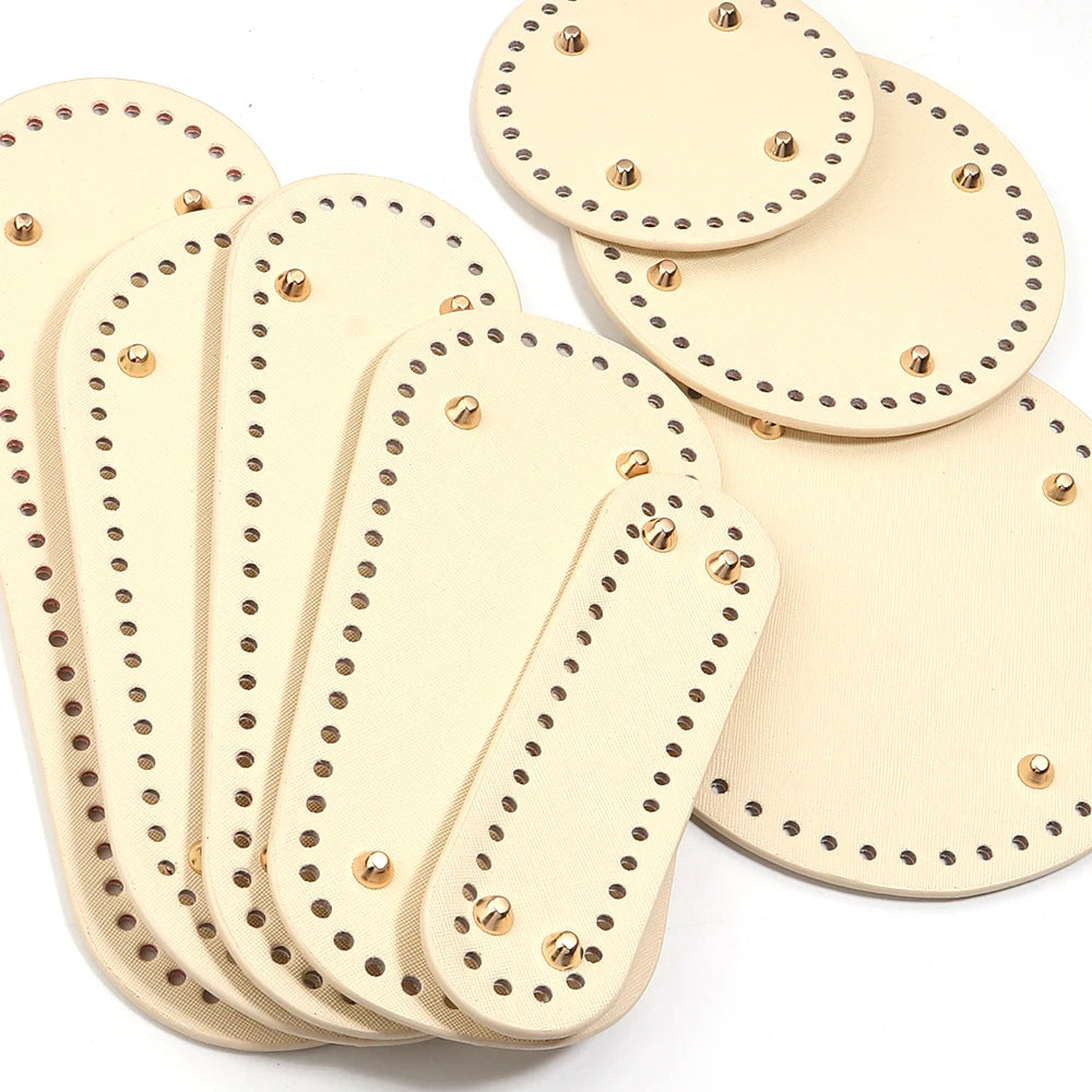 A set of light beige oval PU leather bag bases with pre-punched holes for crochet and knitting