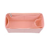 A pink felt insert liner designed to organize and protect handbags.
