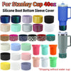 A collection of silicone boot bottom sleeve covers for a Stanley 40oz cup in various colors and patterns.