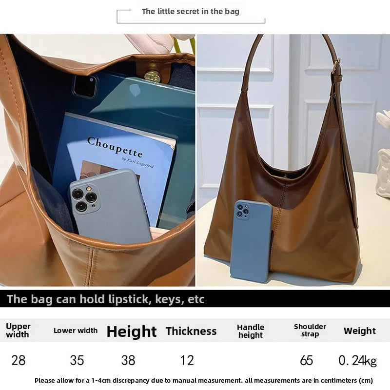 A brown PU leather slouchy hobo shoulder bag is shown open, revealing it holds a smartphone and other items.