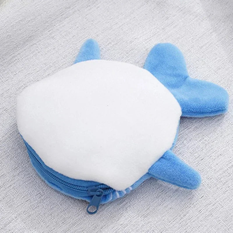 A cute blue shark mini plush coin purse wallet with a white body and zipper.