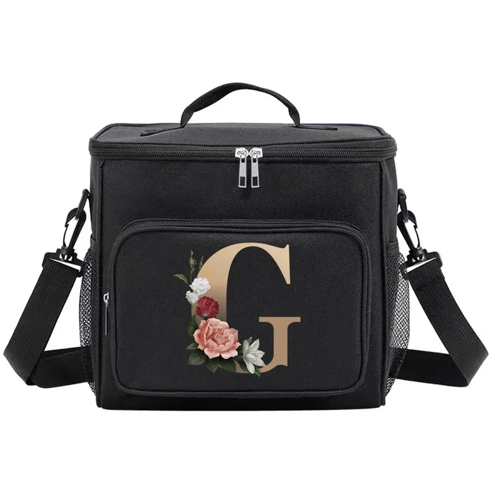 Black insulated canvas lunch bag with a gold initial G and dual handles