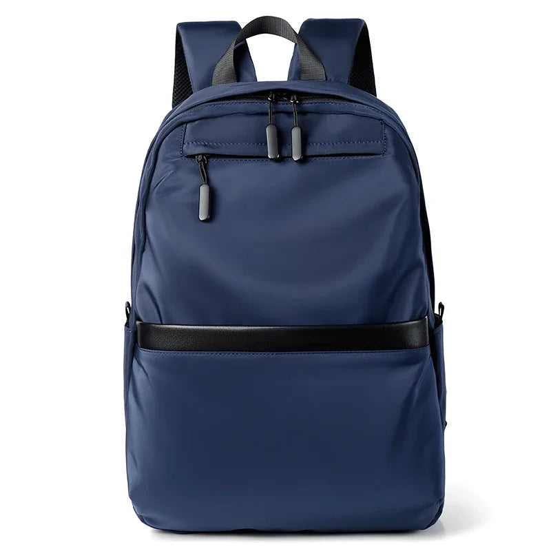 A navy blue men's lightweight laptop backpack with black straps and a horizontal strap detail.