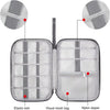 A silver mesh pouch with an elastic belt and nylon zipper, shown open to display its interior organization.