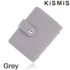 A grey slim leather card holder with a stitched edge and a metal clasp is shown from above.