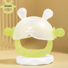 A clear silicone teether shaped like a cute bunny for babies, with a green color, displayed on a white stand.