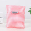 A pink and white striped reusable shopping bag with the brand name BAGCU visible on the front.